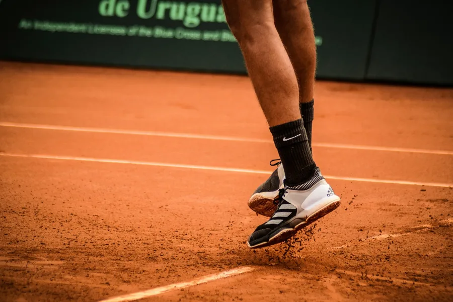 Tennis player's footwork on a clay court